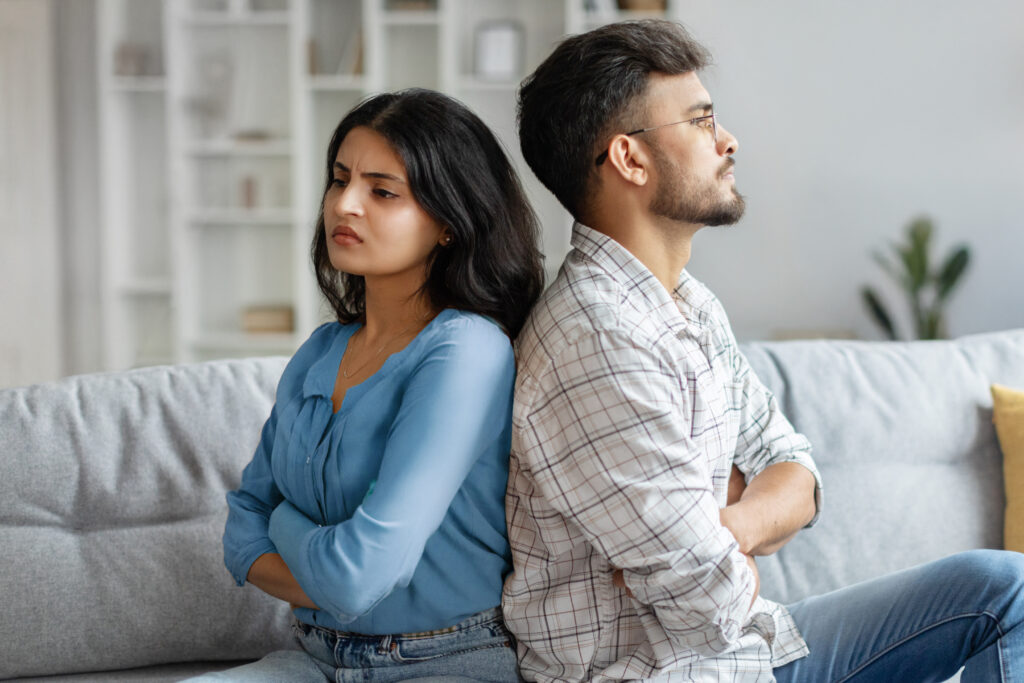 indian-couple-sitting-back-back-couch-home-upset-spouses-offended-after-quarrel-suffering