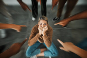 a woman facing a social anxiety and bullying from classmates