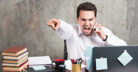 angry-businessman-talking-with-telephone-office-desk_11zon angry man talking with telephone